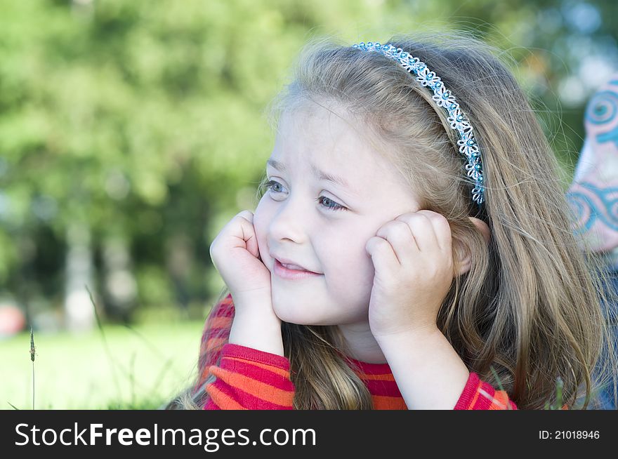 Portrait of little girl in the park