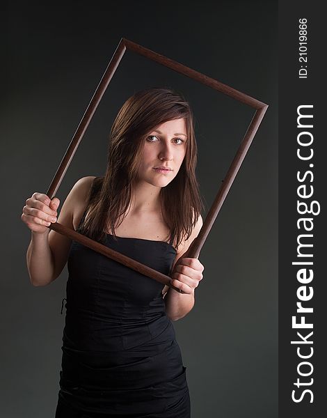 Studio shot of girl with picture frame