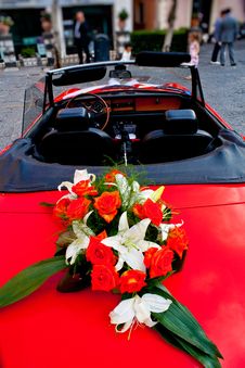 Flower S Bouquet On A Red Car Stock Photo