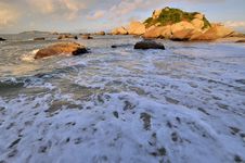 Wide Sea Beach With Rock In Sunrise Stock Photos