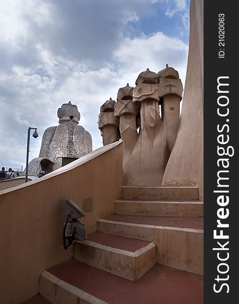 A pciture taken on the roof of the house MilÃ  la Pedrera in Barcelona,with its particular chimneys. A pciture taken on the roof of the house MilÃ  la Pedrera in Barcelona,with its particular chimneys