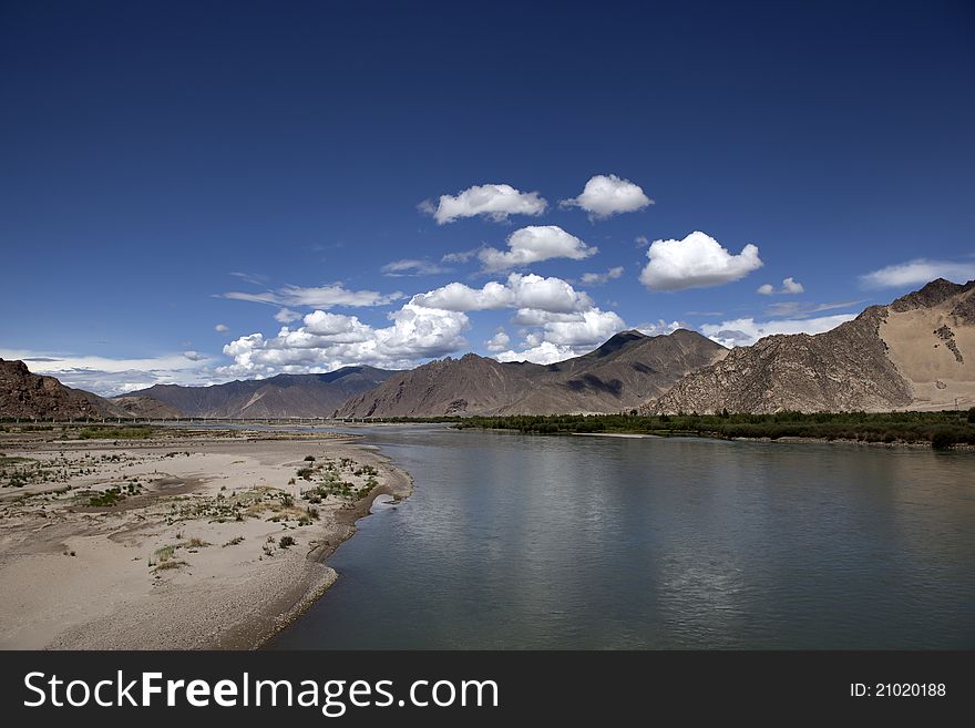 Riverside of Lhasa River and cloudy sky