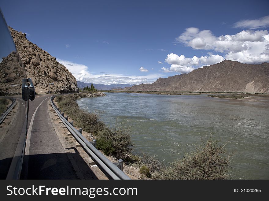 Riverside of Lhasa River and cloudy sky