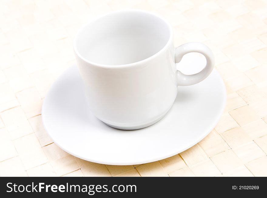 Empty cup with saucer on a table. Empty cup with saucer on a table