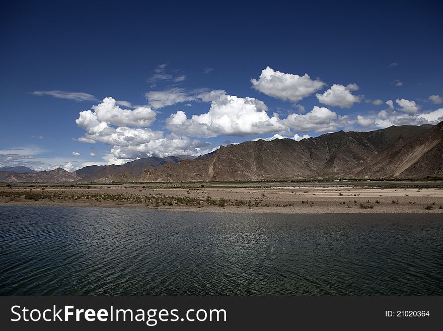Riverside of Lhasa River and cloudy sky
