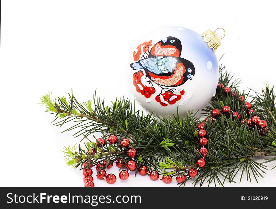 Christmas decorations and spruce twig over white