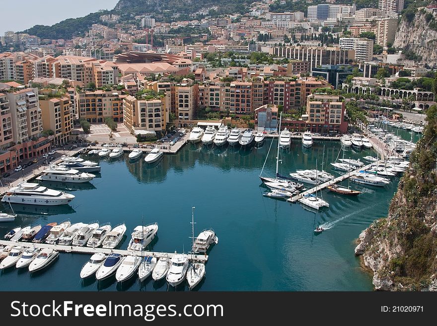 A view of Fontvieille marina in Monaco, surrounded by buildings