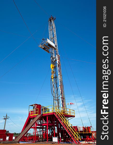 Land drilling rig under blue sky