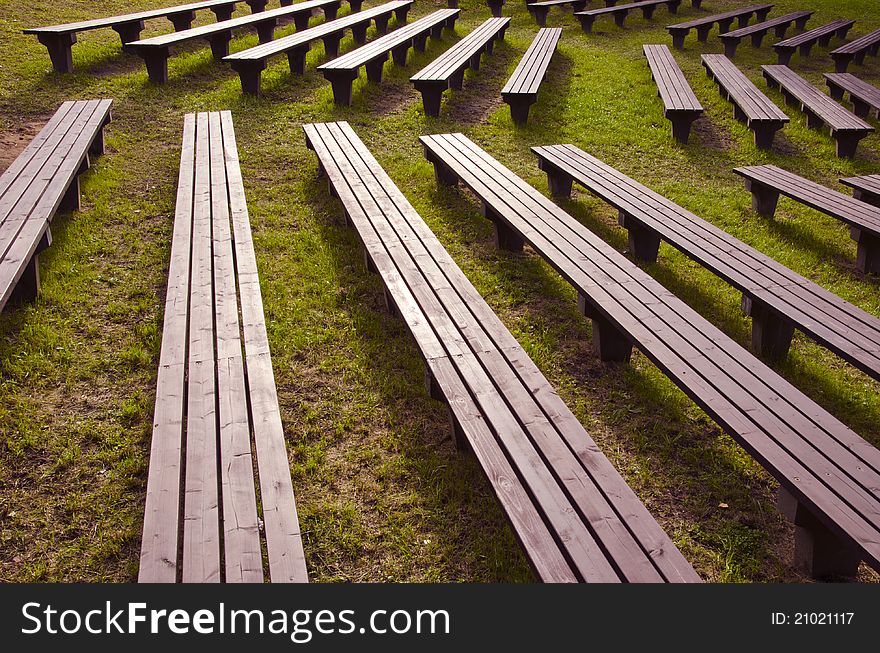 Wooden benches in the summer park. Wooden benches in the summer park