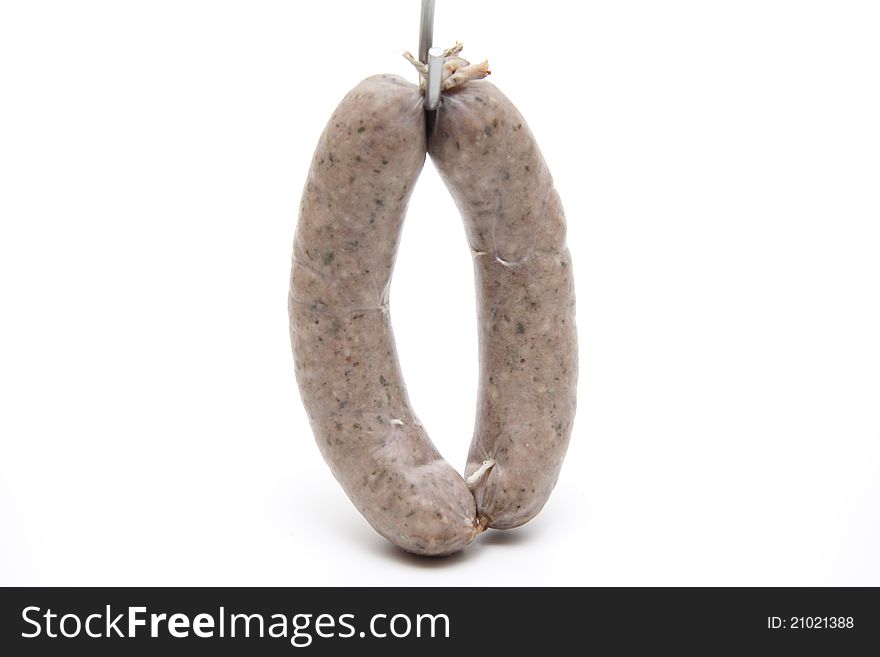 Raw fried sausage with cord on white background