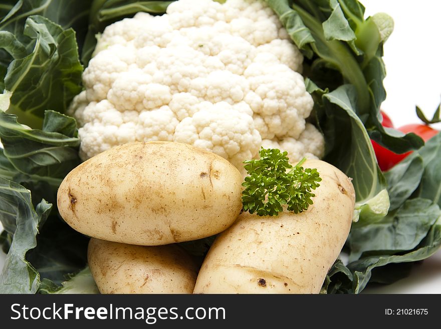 Cauliflower with potatoes on white background