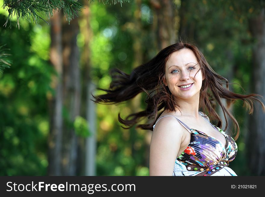 Beautiful woman standing near tree. summer's day. Beautiful woman standing near tree. summer's day.