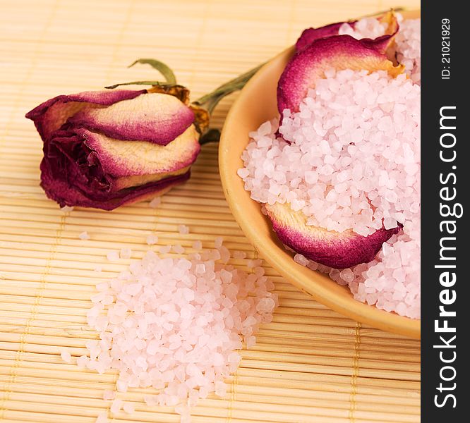 Pink Sea salt and dry rose petals. Pink Sea salt and dry rose petals
