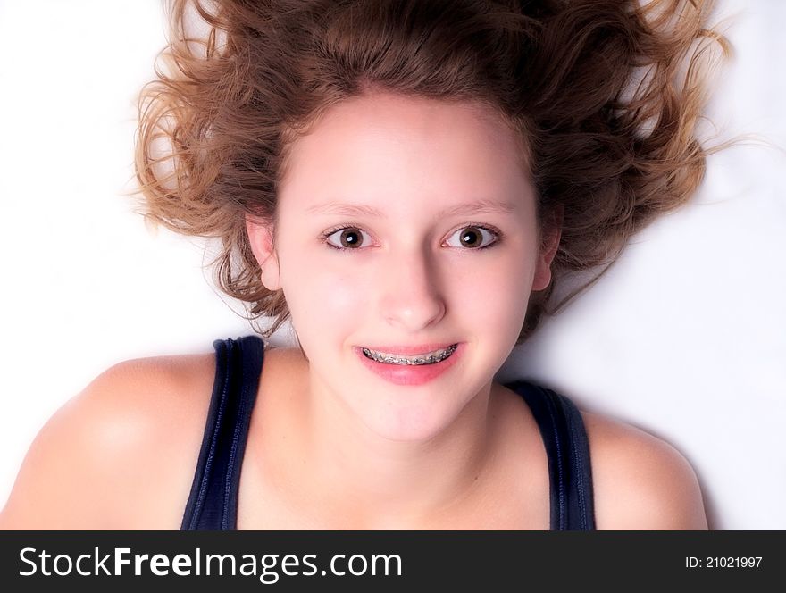 Happy girl with big brown eyes and braces; series of this model in portfolio. Happy girl with big brown eyes and braces; series of this model in portfolio