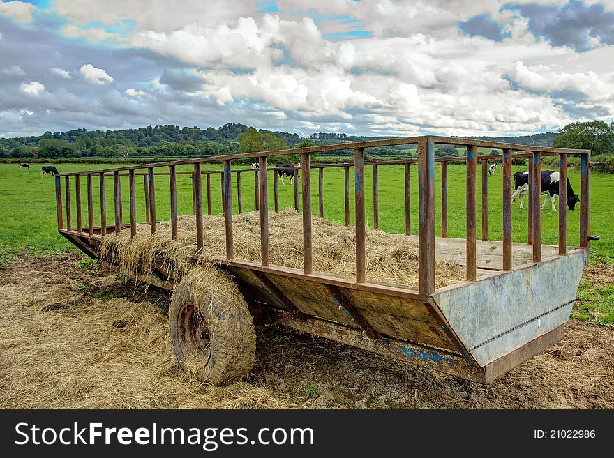 A trailer full of hay on a farm in the English Countryside. A trailer full of hay on a farm in the English Countryside