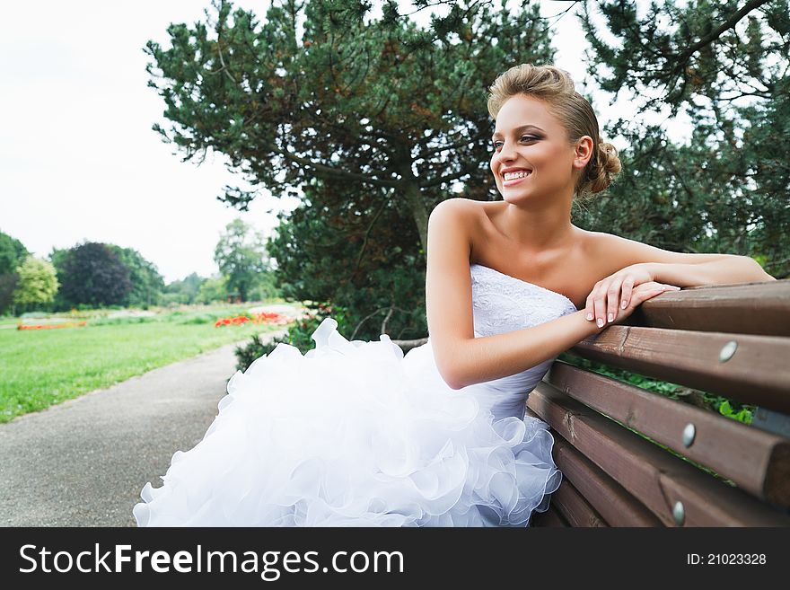 A beautiful bride in the white wedding dress. A beautiful bride in the white wedding dress.