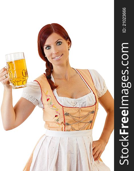 Redheaded bavarian female holding a Glass of Beer wearing a Dirndl