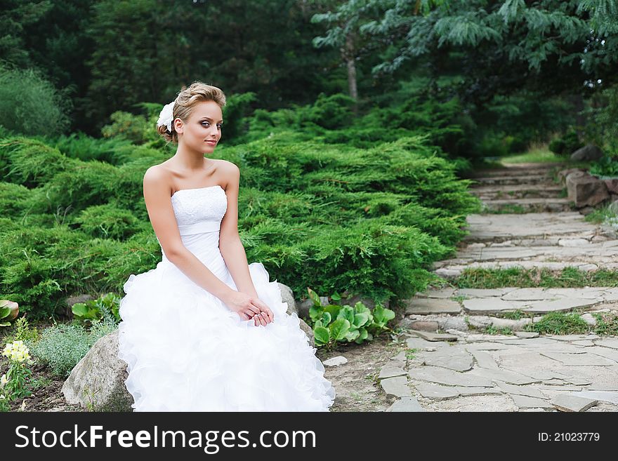 A beautiful bride in the white wedding dress. A beautiful bride in the white wedding dress.