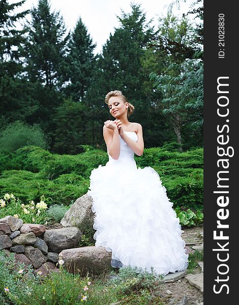 A beautiful bride in the white wedding dress. A beautiful bride in the white wedding dress.