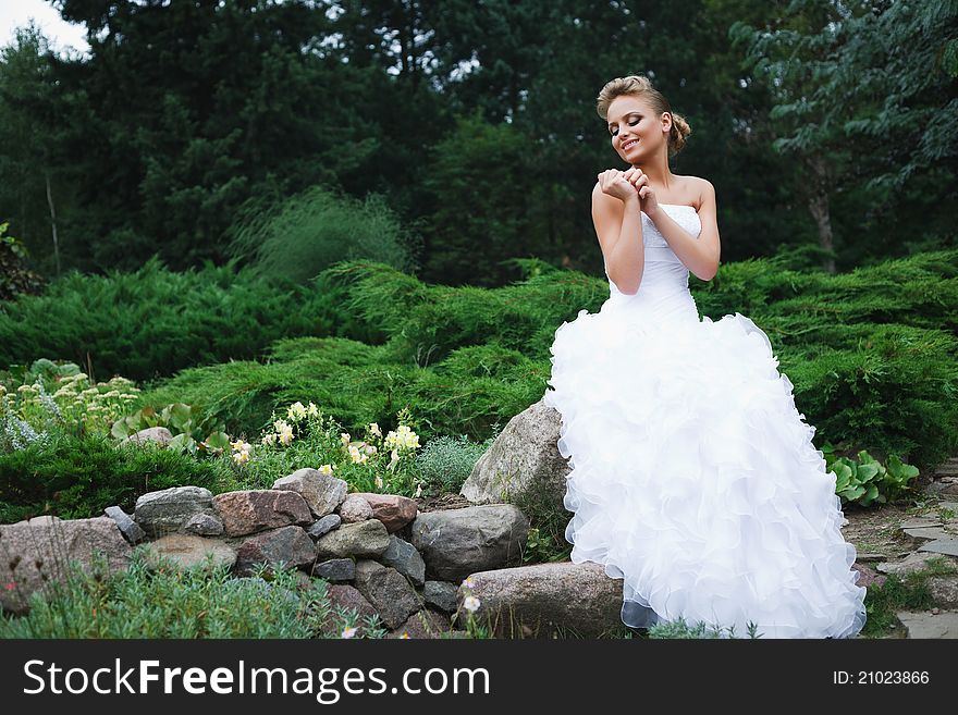 A beautiful bride in the white wedding dress. A beautiful bride in the white wedding dress.