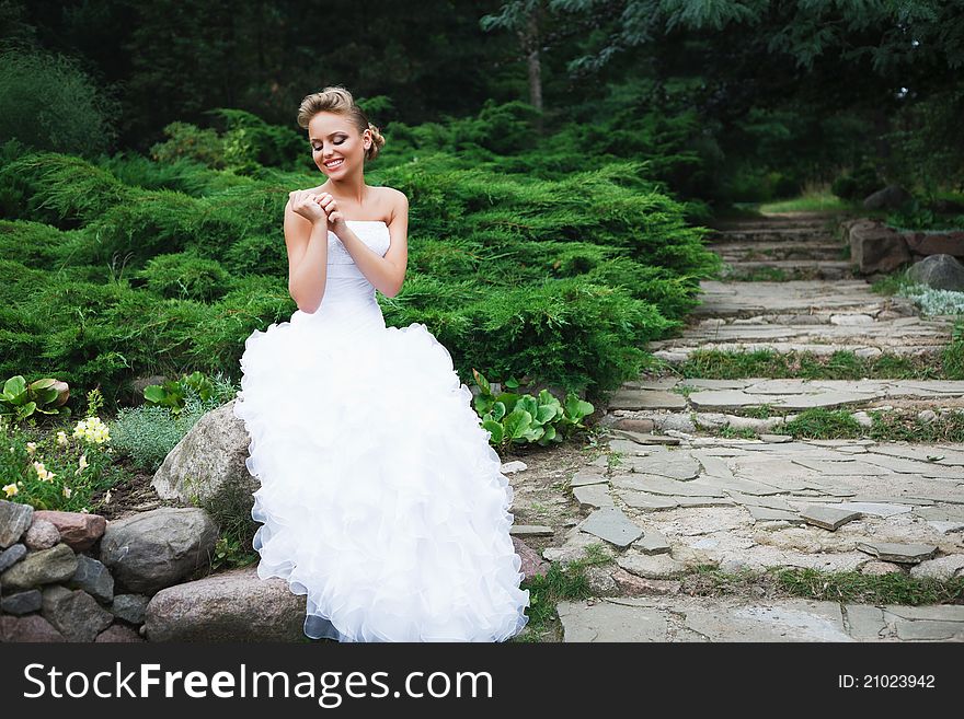 A beautiful bride in the white wedding dress. A beautiful bride in the white wedding dress.