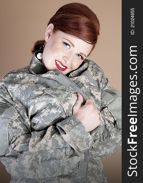 Gorgeous red head woman wearing lover's military jacket. Gorgeous red head woman wearing lover's military jacket