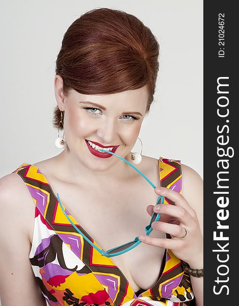 Gorgeous red head retro style model smiling. Gorgeous red head retro style model smiling