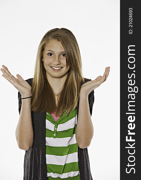 A teenage girl female smiling isolated against a white background. A teenage girl female smiling isolated against a white background
