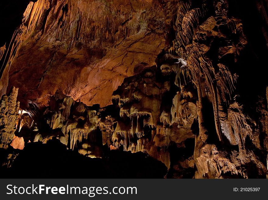 Cave interior with stalagmites and exotic colors