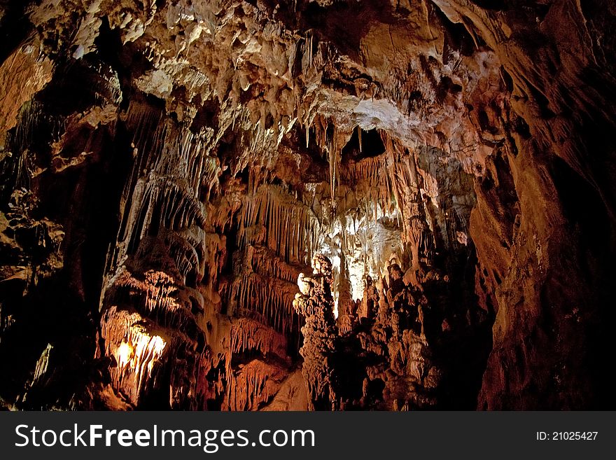 Cave interior with stalagmites and exotic colors