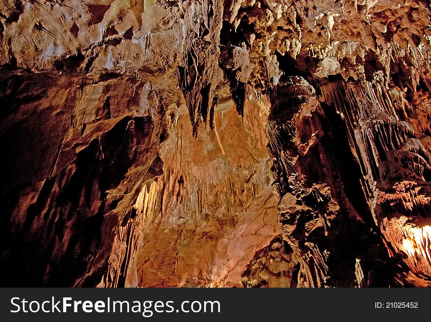 Cave interior with stalagmites and exotic colors