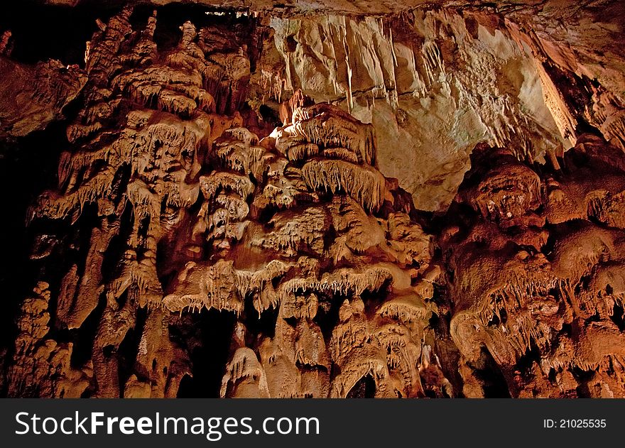 Cave interior with stalagmites and exotic colors