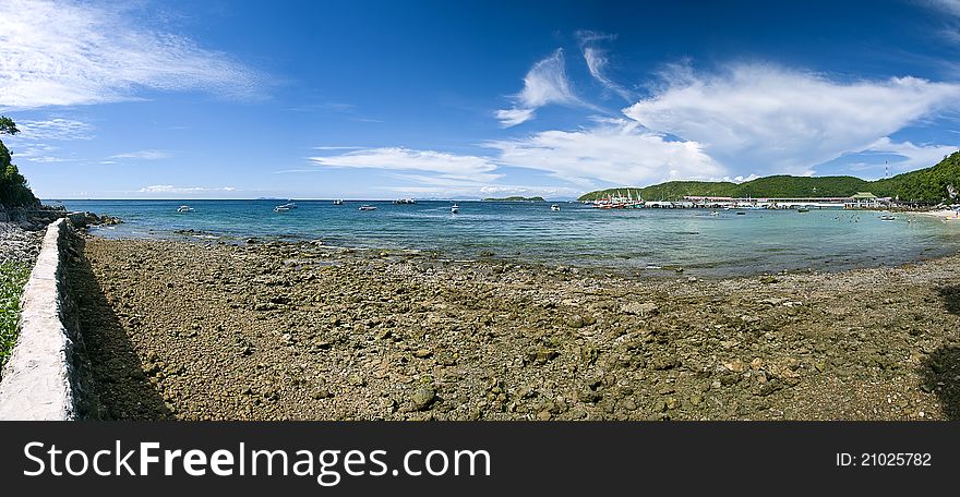 Panorama Sand Beach On Rocky Coast Line