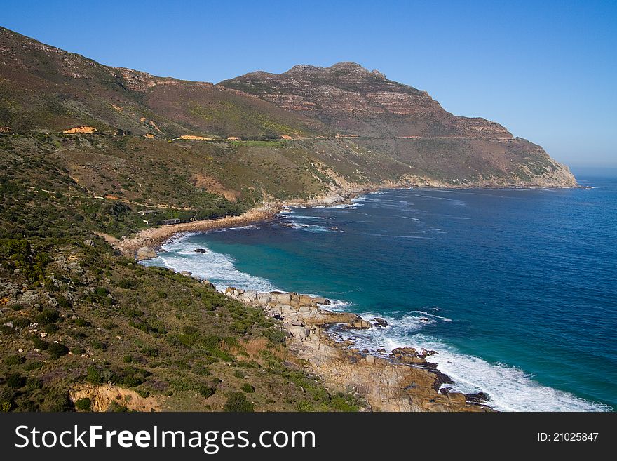 A scene of mountain and ocean along South Africa's coast. A scene of mountain and ocean along South Africa's coast