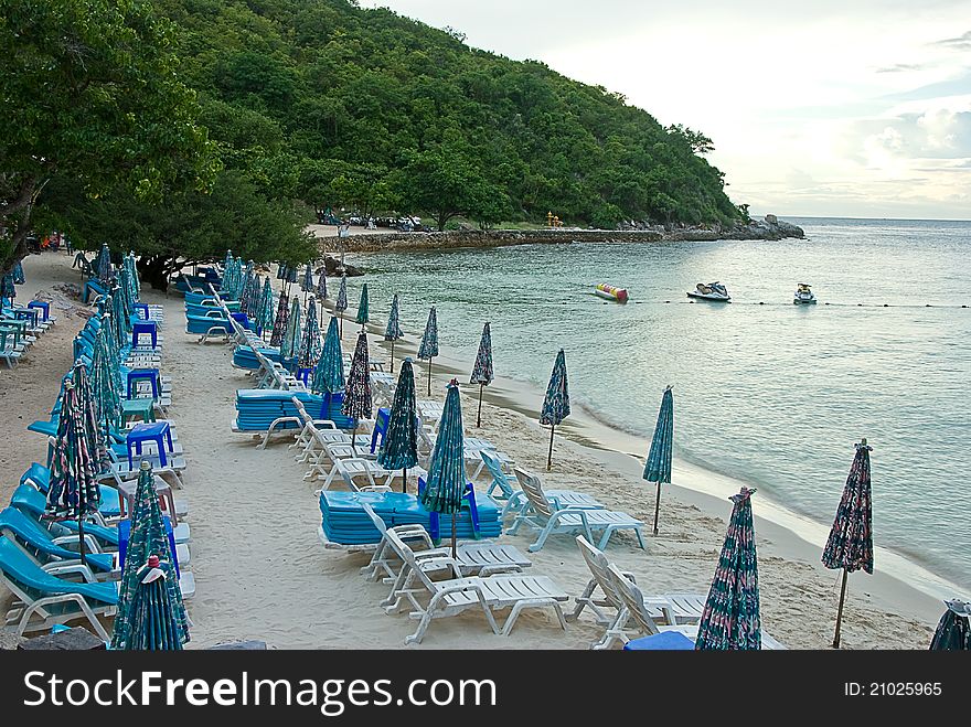 Beach chair and colorful umbrella