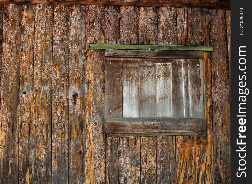 Window Of A Boarded Up Log Cabin