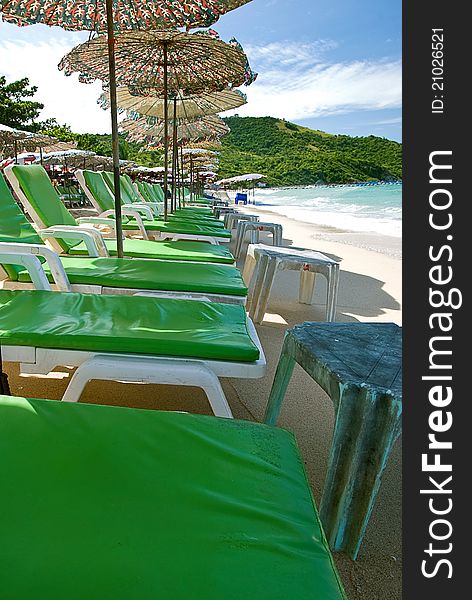 Beach chair and colorful umbrella on the beach , Koh Lan Thailand