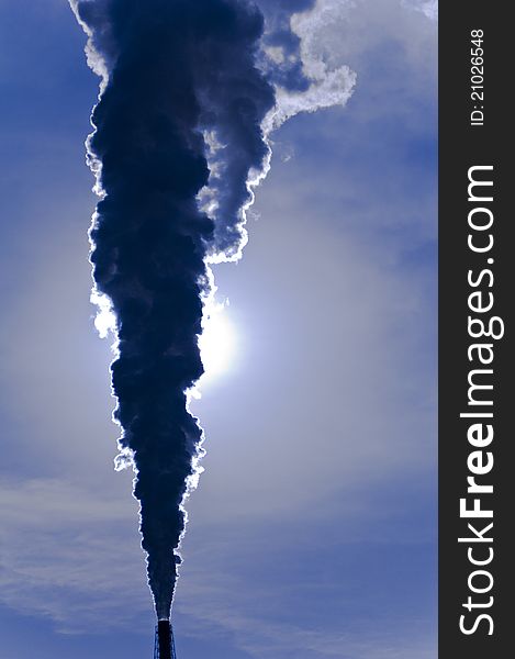 An environmental pollution silhouette. Shot against the sun. An environmental pollution silhouette. Shot against the sun.