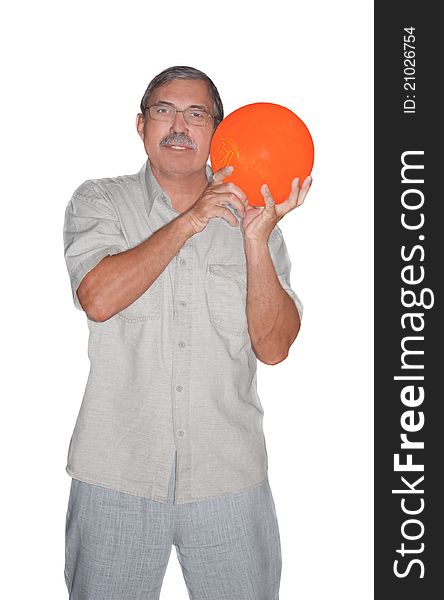Senior man holding orange bowling ball isolated on white background. Senior man holding orange bowling ball isolated on white background