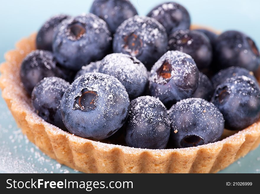 Blueberries Tart On The Blue Background