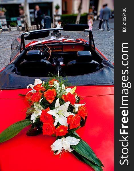 Flower S Bouquet On A Red Car