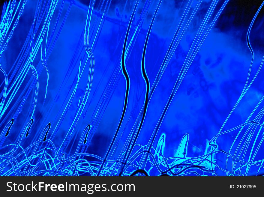 Abstract designs with bright trails on blue. Abstract designs with bright trails on blue