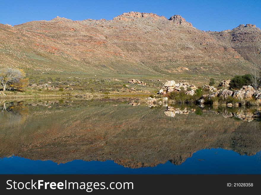 A beautiful mountain reflection in a lake. A beautiful mountain reflection in a lake