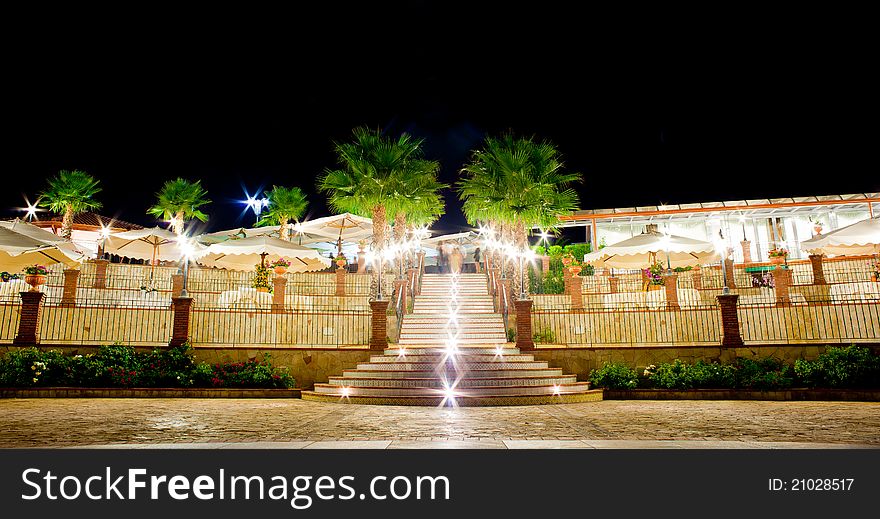 Night view of table set in the garden