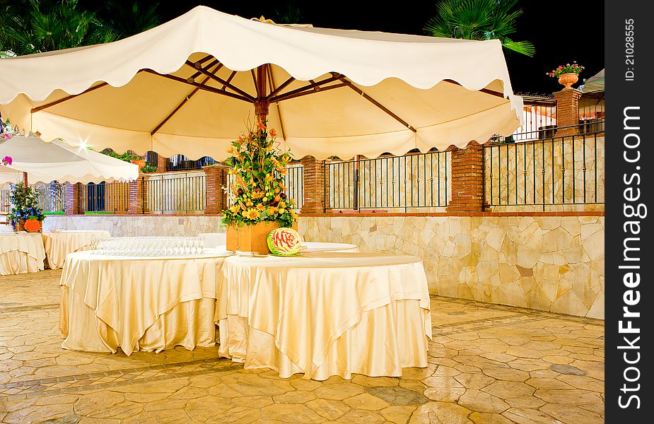 Night view of table set in the garden