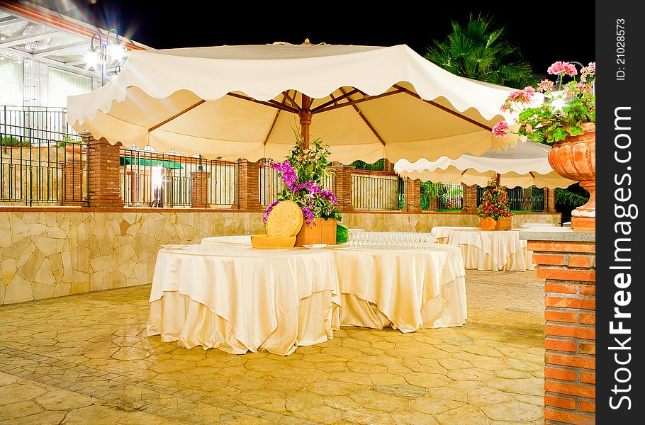 Night view of table set in the garden