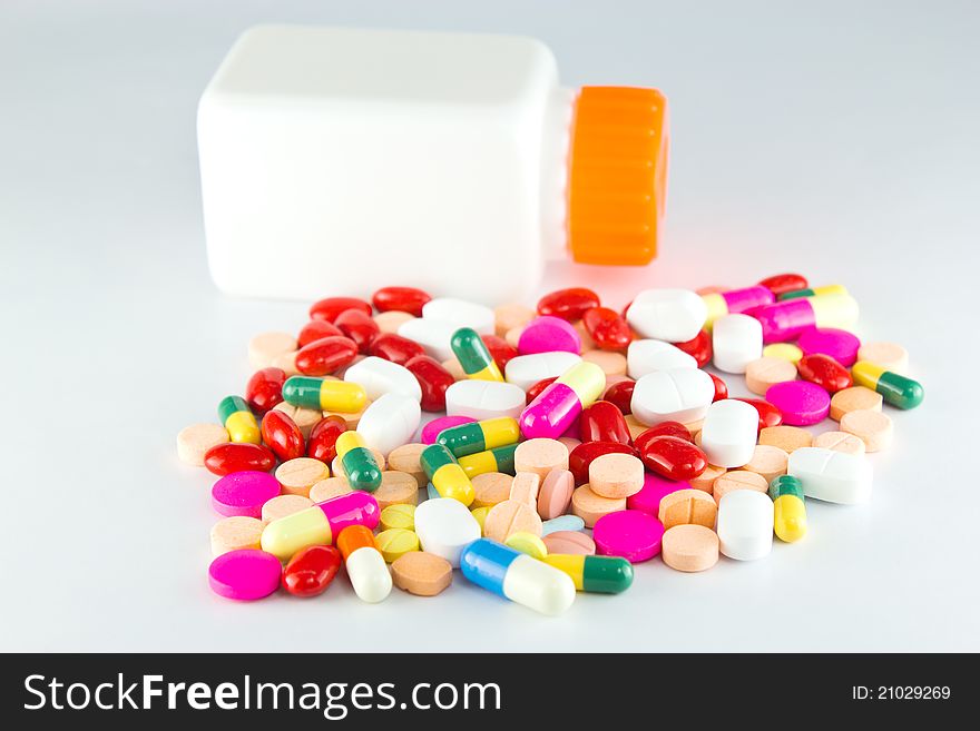 Colorful tablets with capsules and bottle