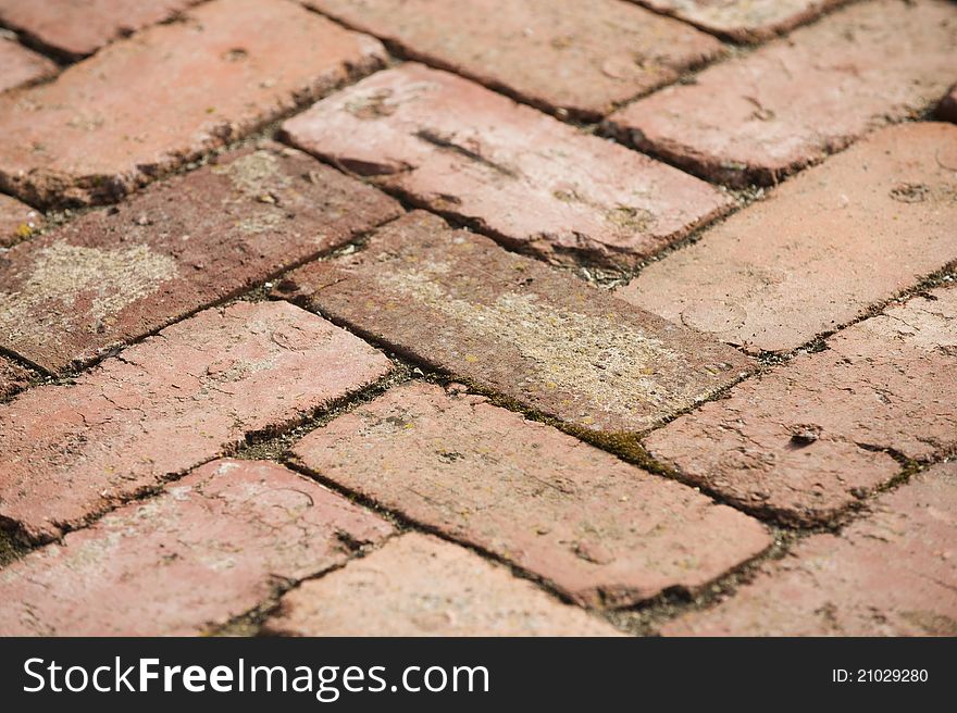 Close up of an old red brick path