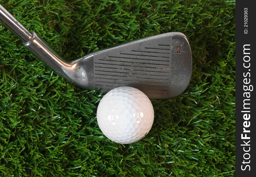 Golfing equipment on artficial grass outdoors