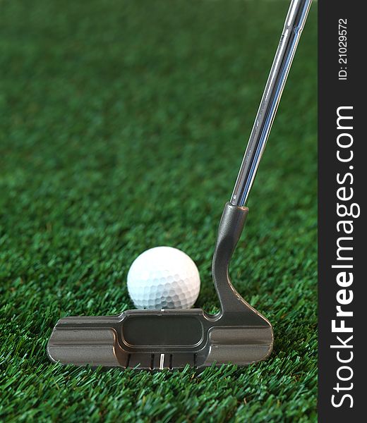 Golfing equipment on artficial grass outdoors